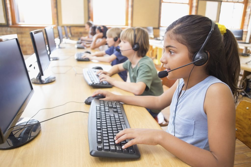 Cute pupils in computer class at the elementary school